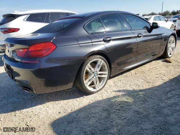 2015 BMW 6 Series 650i with VIN WBA6B2C58FD799063, listed as a Copart auction lot 77819914 with 0 mi miles and Salvage Title. Bid and sale history available at carsss.com. Image 3.