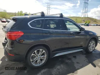 2017 BMW X1 xDrive28i with VIN WBXHT3Z38H4A58005, listed as a Copart auction lot 55837805 with 50,318 mi miles and Salvage title. Bid and sale history available at DreamBid. Image 3.