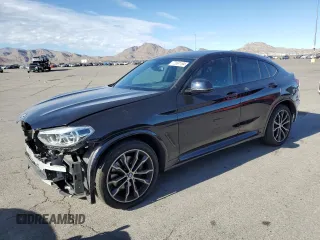 2021 BMW X4 M40i with VIN 5UX2V5C06M9E04443, listed as a Copart auction lot 72061194 with 71,637 mi miles and Salvage Title. Bid and sale history available at carsss.com. Image 1.