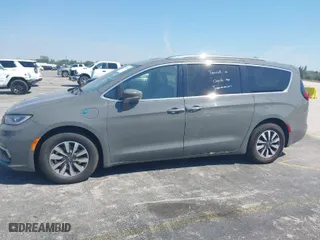 2021 Chrysler Pacifica Hybrid Touring L with VIN 2C4RC1L7XMR586201, listed as a IAAI auction lot 41859340 with 55,906 mi miles. Bid and sale history available at carsss.com. Image 14.