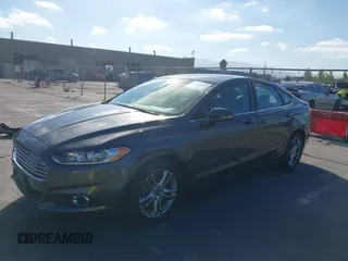 2016 Ford Fusion SE Hybrid z VIN 3FA6P0LU6GR145421, wystawiony jako IAAI lot #42650918 z przebiegiem 105 990 mil mil oraz . Historia ofert i sprzedaży dostępna na DreamBid. Obrazek 6.