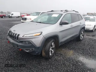 2014 Jeep Cherokee Trailhawk with VIN 1C4PJMBB3EW222747, listed as a IAAI auction lot 41622880 with 183,349 mi miles. Bid and sale history available at carsss.com. Image 2.