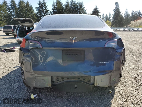 2020 Tesla Model Y Long Range with VIN 5YJYGDEEXLF017789, listed as a Copart auction lot 52705185 with 49,470 mi miles and Salvage Title. Bid and sale history available at DreamBid. Image 6.