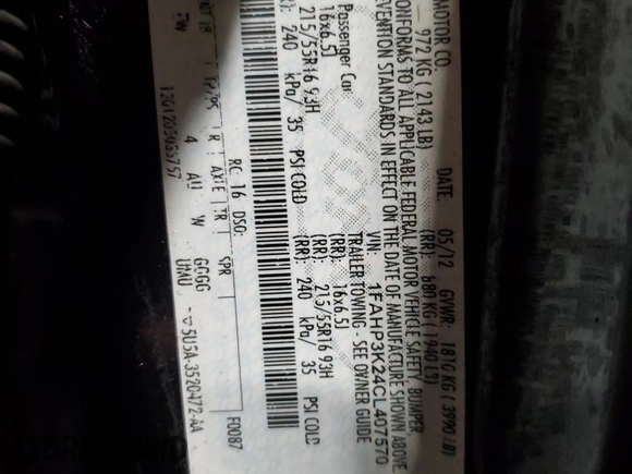 2012 Ford Focus SE z VIN 1FAHP3K24CL407570, wystawiony jako Copart lot #56002135 z przebiegiem 122 730 mil mil oraz Szkoda całkowita • Salvage title. Historia ofert i sprzedaży dostępna na DreamBid. Obrazek 13.