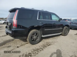 2015 GMC Yukon Denali with VIN 1GKS1CKJ1FR303049, listed as a Copart auction lot 82435514 with 100,693 mi miles and Salvage Title. Bid and sale history available at carsss.com. Image 3.
