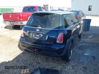 2006 MINI Hardtop S with VIN WMWRE33546TJ34712, listed as a IAAI auction lot 41144701 with 230,006 mi miles and . Bid and sale history available at DreamBid. Image 4.