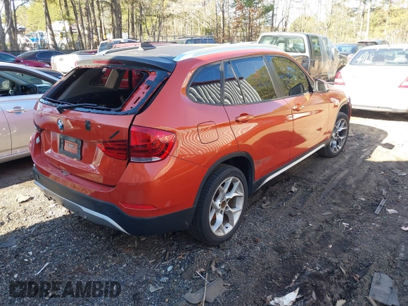 2015 BMW X1 xDrive28i with VIN WBAVL1C58FVY24900, listed as a IAAI auction lot 41772097 with 128,001 mi miles. Bid and sale history available at carsss.com. Image 4.
