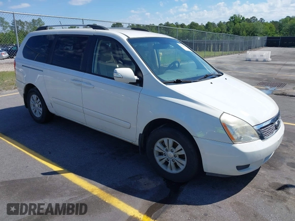 2012 Kia Sedona LX with VIN KNDMG4C71C6447550, listed as a IAAI auction lot 42190357 with 161,960 mi miles. Bid and sale history available at carsss.com. Image 1.