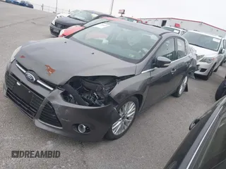 2014 Ford Focus Titanium with VIN 1FADP3J20EL236805, listed as a IAAI auction lot 41708437 with 105,724 mi miles. Bid and sale history available at carsss.com. Image 2.