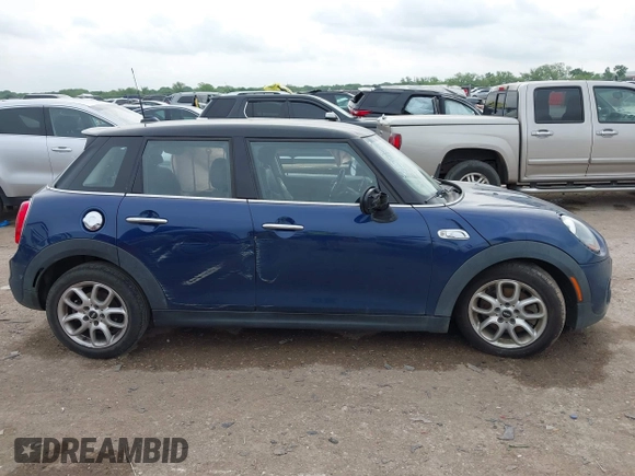 2017 MINI Hardtop 4 Door Cooper S z VIN WMWXU3C3XH2F49313, wystawiony jako IAAI lot #42137594 z przebiegiem 87 865 mil mil oraz . Historia ofert i sprzedaży dostępna na DreamBid. Obrazek 12.