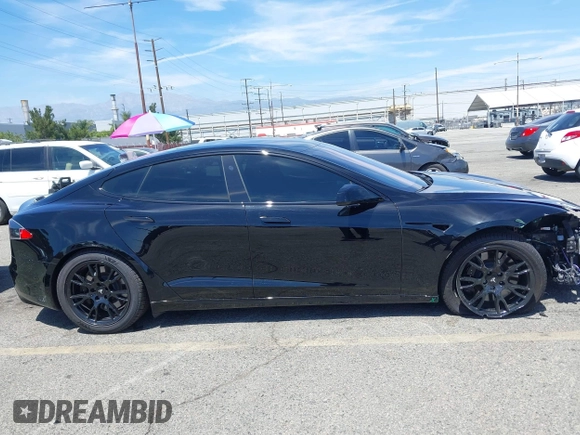 2022 Tesla Model S with VIN 5YJSA1E51NF464231, listed as a IAAI auction lot 42077838 with 53,290 mi miles and . Bid and sale history available at DreamBid. Image 14.