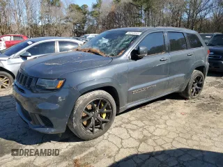 2018 Jeep Grand Cherokee Trackhawk with VIN 1C4RJFN99JC411265, listed as a Copart auction lot 45313345 with 59,338 mi miles and Salvage title. Bid and sale history available at DreamBid. Image 1.