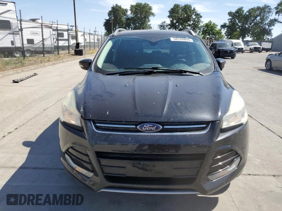2015 Ford Escape Titanium with VIN 1FMCU0J97FUC80446, listed as a Copart auction lot 58749895 with 106,890 mi miles and Salvage title. Bid and sale history available at DreamBid. Image 5.