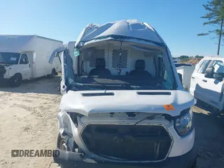 2022 Ford Transit Cargo with VIN 1FTBR3X81NKA63860, listed as a IAAI auction lot 42323904 with 94,473 mi miles and . Bid and sale history available at DreamBid. Image 6.