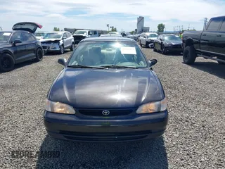 1999 Toyota Corolla VE z VIN 1NXBR12E9XZ205120, wystawiony jako IAAI lot #42216177 z przebiegiem 175 508 mil mil oraz . Historia ofert i sprzedaży dostępna na DreamBid. Obrazek 12.