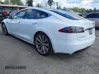 2016 Tesla Model S 90D with VIN 5YJSA1E22GF155747, listed as a IAAI auction lot 42630085 with 97,896 mi miles and . Bid and sale history available at DreamBid. Image 3.