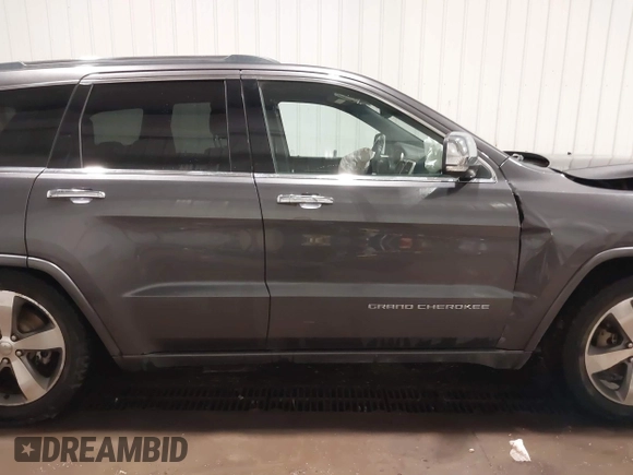 2015 Jeep Grand Cherokee Overland z VIN 1C4RJFCG1FC663469, wystawiony jako IAAI lot #41666113 z przebiegiem 140 159 mil mil oraz . Historia ofert i sprzedaży dostępna na DreamBid. Obrazek 13.