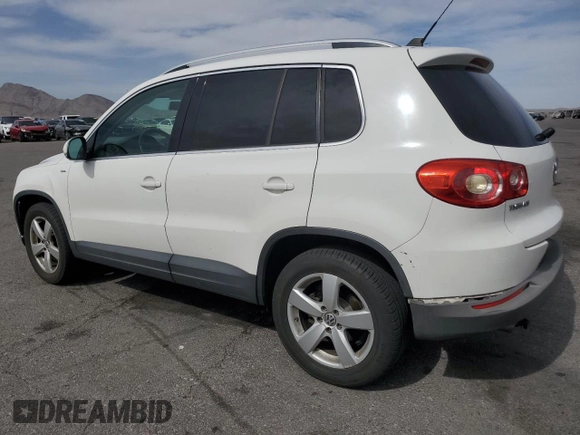 2010 Volkswagen Tiguan Wolfsburg Edition with VIN WVGAV7AX7AW003188, listed as a Copart auction lot 56692535 with 121,502 mi miles and Salvage title. Bid and sale history available at DreamBid. Image 2.