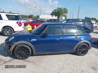 2016 MINI Cooper Hardtop 4 Door S with VIN WMWXU3C54G2D30766, listed as a IAAI auction lot 42008026 with 101,898 mi miles. Bid and sale history available at carsss.com. Image 14.
