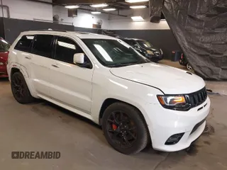 2018 Jeep Grand Cherokee SRT z VIN 1C4RJFDJ1JC270610, wystawiony jako IAAI lot #39955518 z przebiegiem 52 467 mil mil oraz . Historia ofert i sprzedaży dostępna na DreamBid. Obrazek 1.