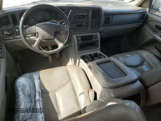 2005 GMC Yukon SLE z VIN 1GKEC13T75J179930, wystawiony jako Copart lot #57259205 z przebiegiem 310 454 mil mil oraz Szkody całkowita. Historia ofert i sprzedaży dostępna na DreamBid. Obrazek 8.