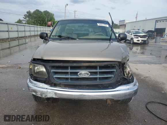2003 Ford F-150 XL with VIN 1FTRX17LX3NA38576, listed as a Copart auction lot 54057495 with 173,811 mi miles and Salvage title. Bid and sale history available at DreamBid. Image 5.