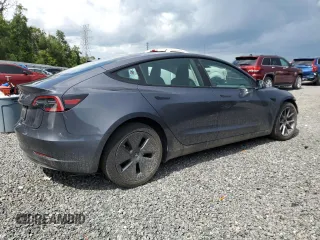 2023 Tesla Model 3 z VIN 5YJ3E1EA1PF692481, wystawiony jako Copart lot #61764165 z przebiegiem 22 649 mil mil oraz Szkoda całkowita • Salvage title. Historia ofert i sprzedaży dostępna na DreamBid. Obrazek 3.
