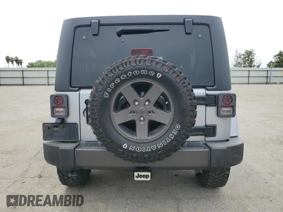 2016 Jeep Wrangler Unlimited Sport z VIN 1C4BJWDG5GL179046, wystawiony jako Copart lot #52989725 z przebiegiem 129 051 mil mil oraz Szkoda całkowita • Salvage title. Historia ofert i sprzedaży dostępna na DreamBid. Obrazek 6.