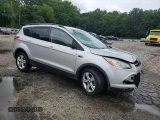 2013 Ford Escape SE with VIN 1FMCU0GX7DUA57262, listed as a Copart auction lot 59088705 with 157,201 mi miles and Salvage title. Bid and sale history available at DreamBid. Image 4.