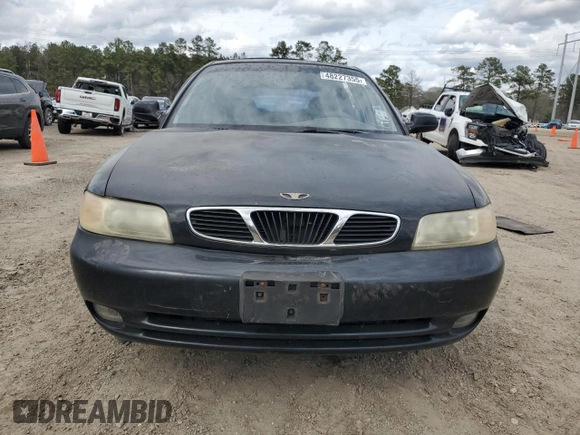 1999 Daewoo Nubira CDX z VIN KLAJB82Z5XK301054, wystawiony jako Copart lot #48227355 z przebiegiem 66 730 mil mil oraz Szkody całkowita. Historia ofert i sprzedaży dostępna na DreamBid. Obrazek 5.