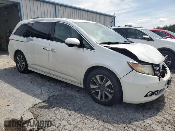 2014 Honda Odyssey Touring with VIN 5FNRL5H94EB080815, listed as a Copart auction lot 65244325 with 153,314 mi miles and Salvage title. Bid and sale history available at DreamBid. Image 4.