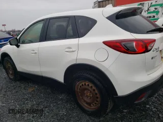 2014 Mazda CX-5 Touring z VIN JM3KE4CY1E0406726, wystawiony jako Copart lot #54652065 z przebiegiem 245 491 mil mil oraz Szkoda całkowita • Salvage title. Historia ofert i sprzedaży dostępna na DreamBid. Obrazek 2.