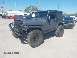 2003 Jeep Wrangler X with VIN 1J4FA39S03P314685, listed as a IAAI auction lot 41649741 with 119,924 mi miles. Bid and sale history available at carsss.com. Image 20.