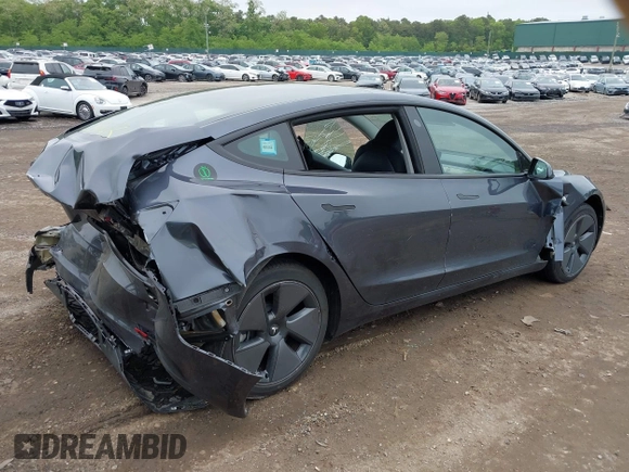 2023 Tesla Model 3 with VIN 5YJ3E1EA9PF673399, listed as a IAAI auction lot 42392643 with 7,571 mi miles and . Bid and sale history available at DreamBid. Image 4.