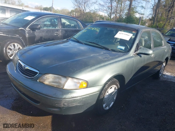 1998 Mazda 626 DX with VIN 1YVGF22C4W5768778, listed as a IAAI auction lot 41971066 with 119,168 mi miles. Bid and sale history available at carsss.com. Image 17.