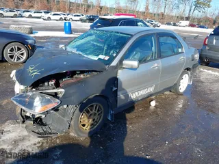 2006 Mitsubishi Lancer OZ-Rally with VIN JA3AJ86E56U000207, listed as a IAAI auction lot 41401698 with 239,219 mi miles. Bid and sale history available at carsss.com. Image 2.