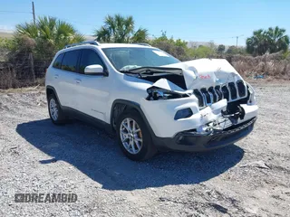 2015 Jeep Cherokee Latitude with VIN 1C4PJLCS7FW737387, listed as a IAAI auction lot 41759678 with 143,047 mi miles. Bid and sale history available at carsss.com. Image 1.