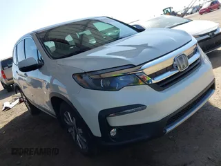 2019 Honda Pilot EX-L z VIN 5FNYF6H52KB083410, wystawiony jako IAAI lot #42290286 z przebiegiem 95 534 mil mil oraz . Historia ofert i sprzedaży dostępna na DreamBid. Obrazek 1.