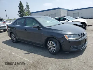 2013 Volkswagen Jetta SE with VIN 3VWDX7AJ6DM438180, listed as a Copart auction lot 59582655 with 106,082 mi miles and Salvage title. Bid and sale history available at DreamBid. Image 4.
