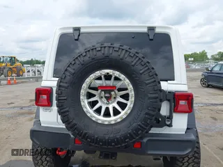 2021 Jeep Wrangler Unlimited Rubicon with VIN 1C4HJXFG7MW527498, listed as a IAAI auction lot 42393520 with 18,085 mi miles and . Bid and sale history available at DreamBid. Image 16.