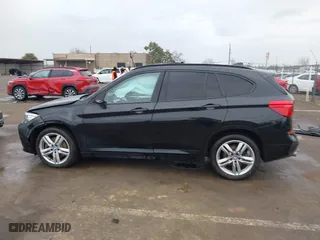 2021 BMW X1 xDrive28i with VIN WBXJG9C01M3M71033, listed as a IAAI auction lot 41723970 with 71,000 mi miles. Bid and sale history available at carsss.com. Image 14.
