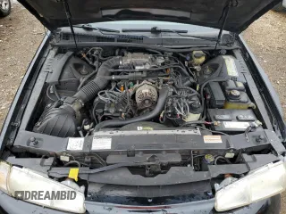 1997 Ford Thunderbird LX z VIN 1FALP62W0VH157636, wystawiony jako Copart lot #57436535 z przebiegiem 120 433 mil mil oraz Szkoda całkowita • Salvage title. Historia ofert i sprzedaży dostępna na DreamBid. Obrazek 11.