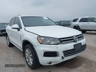 2012 Volkswagen Touareg Lux with VIN WVGEK9BPXCD006816, listed as a IAAI auction lot 42289916 with 116,658 mi miles and . Bid and sale history available at DreamBid. Image 1.
