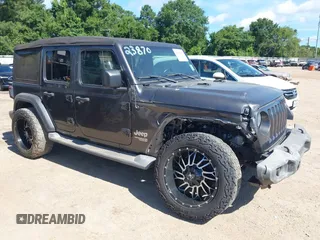 2018 Jeep Wrangler Unlimited Sport S with VIN 1C4HJXDN6JW277829, listed as a IAAI auction lot 42607187 with 107,461 mi miles and . Bid and sale history available at DreamBid. Image 1.