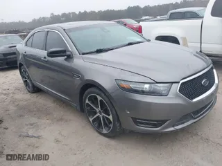 2014 Ford Taurus SHO with VIN 1FAHP2KT0EG171336, listed as a IAAI auction lot 41566688 with 154,328 mi miles. Bid and sale history available at carsss.com. Image 1.