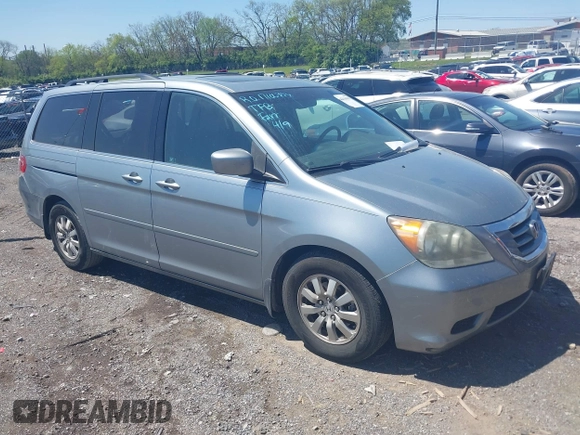 2010 Honda Odyssey EX-L with VIN 5FNRL3H62AB001954, listed as a IAAI auction lot 42028959 with 142,743 mi miles. Bid and sale history available at carsss.com. Image 1.
