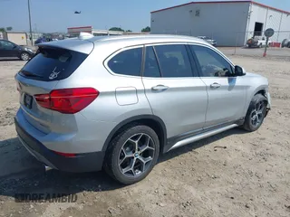 2018 BMW X1 xDrive28i with VIN WBXHT3C39J5L27926, listed as a IAAI auction lot 42582330 with 101,197 mi miles and . Bid and sale history available at DreamBid. Image 4.