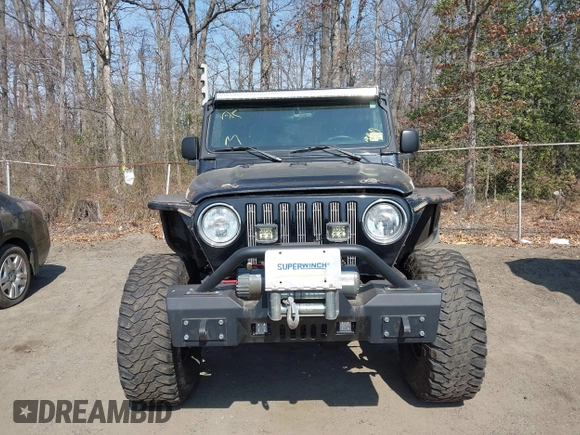 2004 Jeep Wrangler Rubicon with VIN 1J4FA69S64P789308, listed as a IAAI auction lot 41714489 with 186,302 mi miles. Bid and sale history available at carsss.com. Image 12.