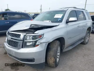 2016 Chevrolet Tahoe LS with VIN 1GNSCAEC2GR392937, listed as a IAAI auction lot 42648714 with 166,764 mi miles and . Bid and sale history available at DreamBid. Image 2.