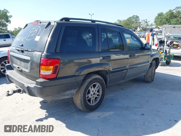 2004 Jeep Grand Cherokee Laredo with VIN 1J4GW48S74C401022, listed as a IAAI auction lot 41982319 with 170,607 mi miles. Bid and sale history available at carsss.com. Image 4.